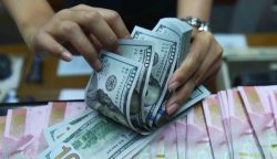 Ilustrasi rupiah dan dolar AS.